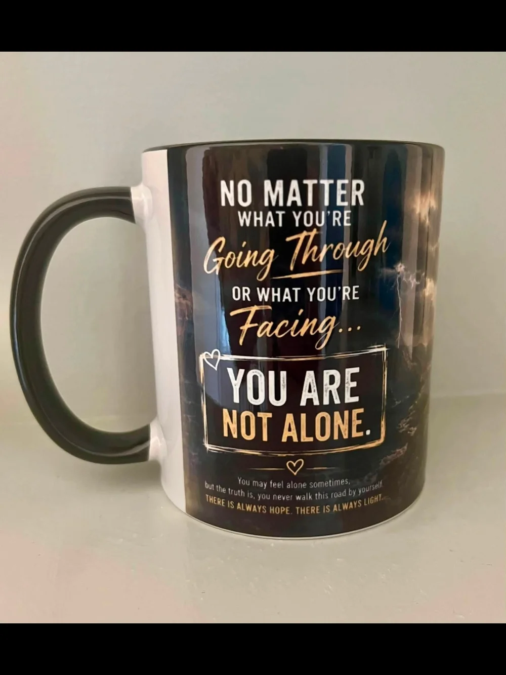 Motivational Black Ceramic Mug — You Are Not Alone
